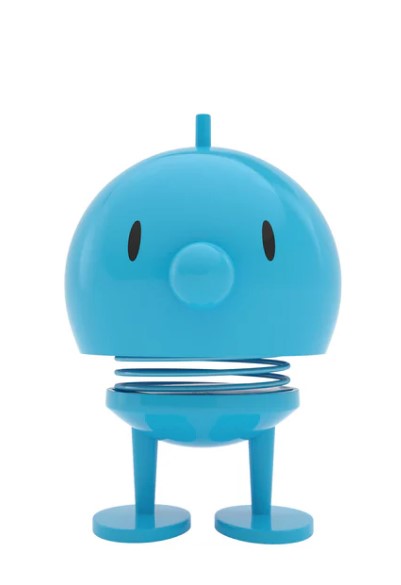 A blue cartoon-like character statue on a white background