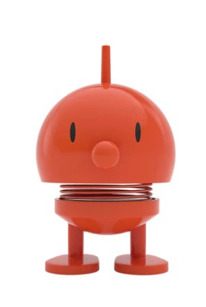 An orange cartoon-like character statue on a white background