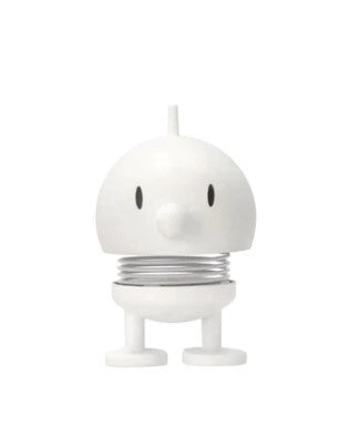 White cartoon-like character statue on a white background.