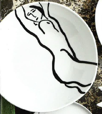 White serving bowl featuring an illustration of a reclining nude woman